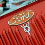 The Ford V8 badge on a red engine block