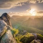 Sunrise over a misty mountain range
