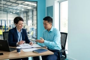 Auditor reviewing records with a client
