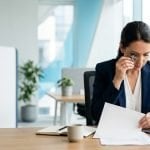 Professional examining an ISO certificate