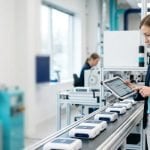 Inspector checking products on a line