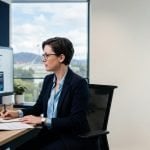 Policy advisor reviewing cyber security requirements