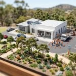 Tilt-shift miniature diorama of an Australian local council civic office and adjoining works depot, with residents at a service counter and a road maintenance crew in hi-vis beside works trucks